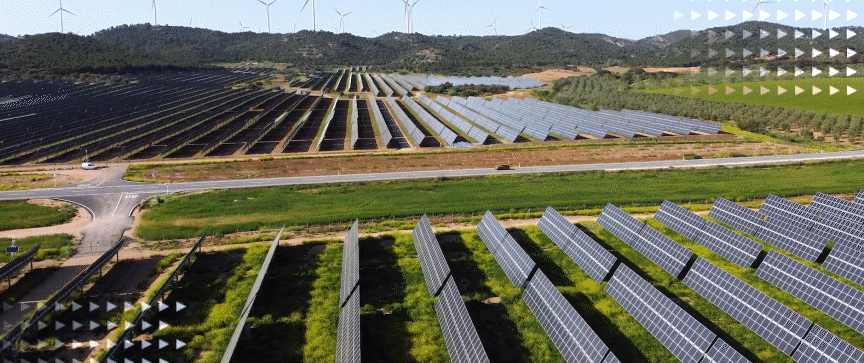 Solar panels and wind turbines in South America.